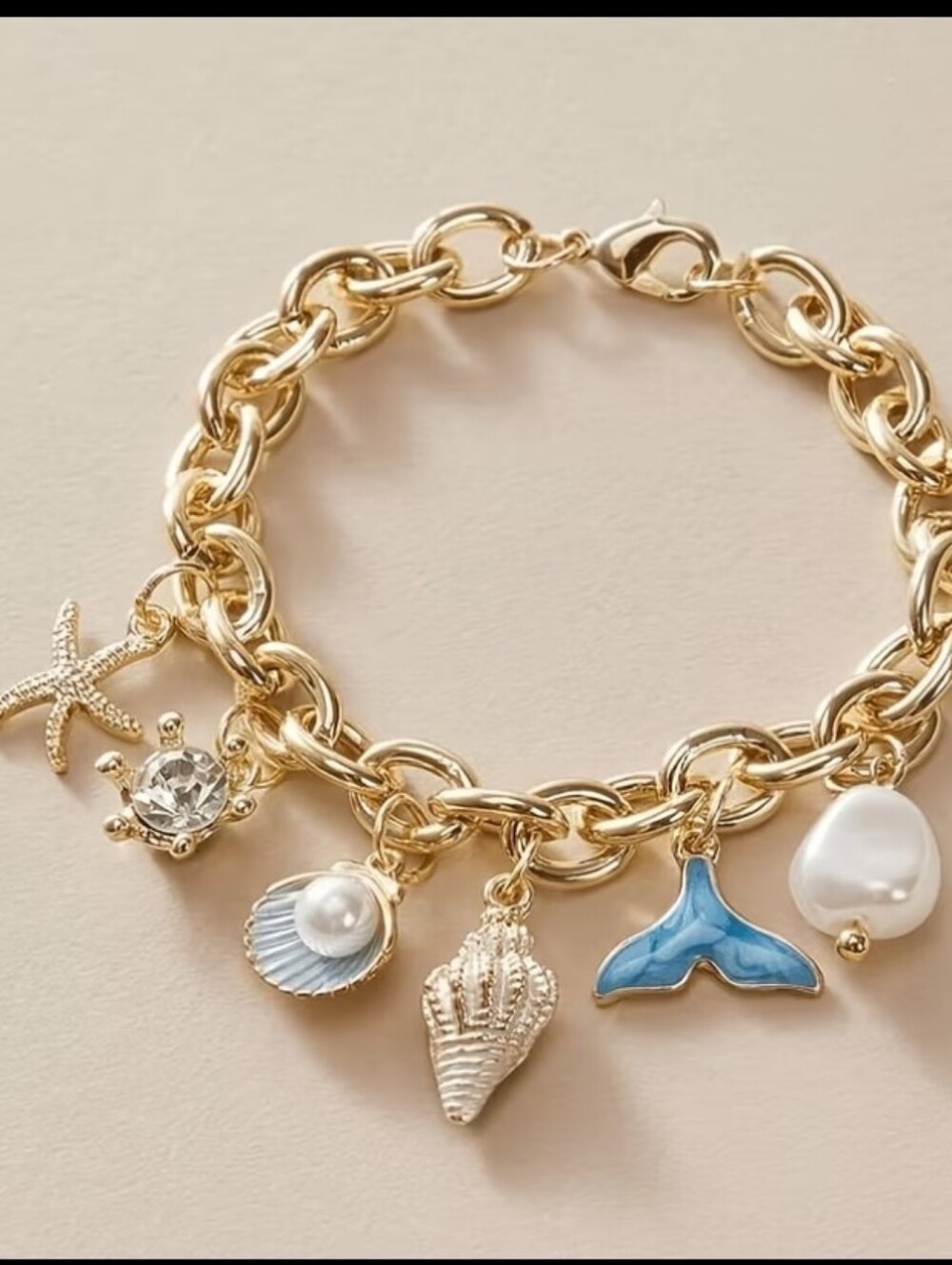 Gold Tone Ocean Charm Bracelet with Blue Whale Tail